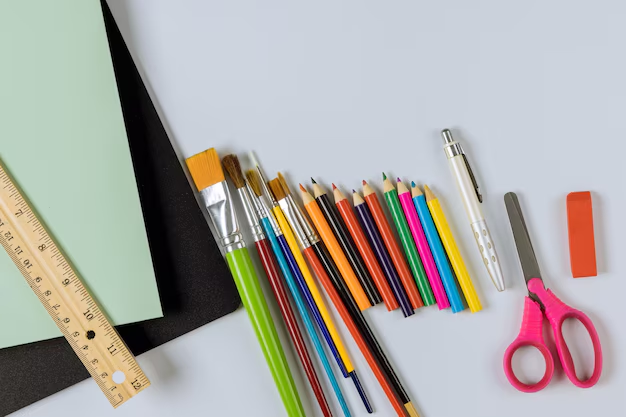 Essential art supplies for DIY coloring page creation, including paper, pens, and pencil